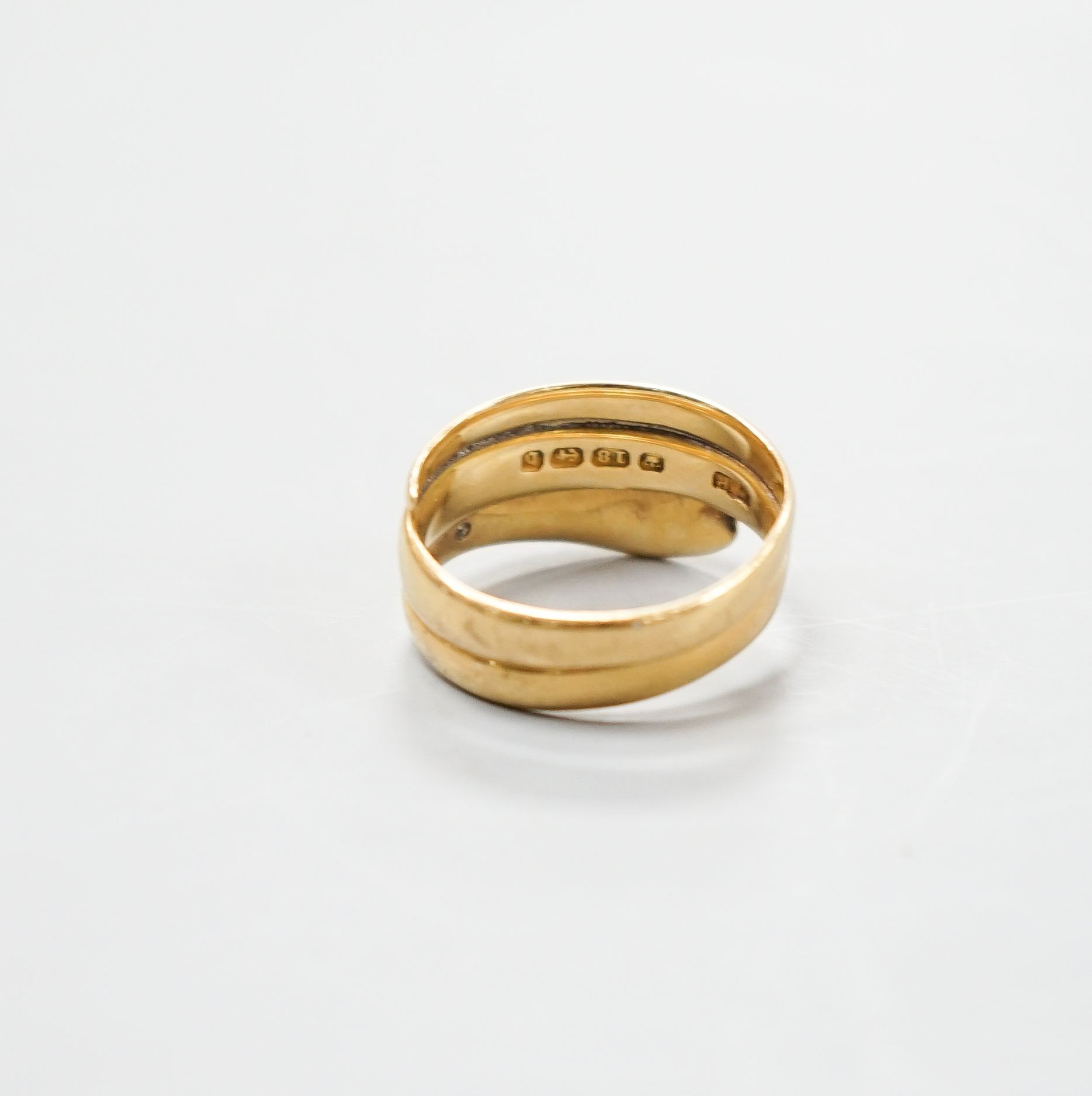 A late Victorian 18ct gold 'serpent' ring, hallmarked for Birmingham, 1876, size R/S, 8.5 grams.